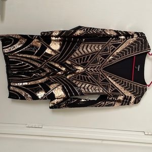 Black and gold sequin dress